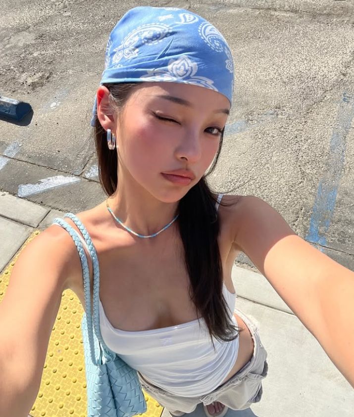Blue paisley bandana tied as a do-rag in the sun.